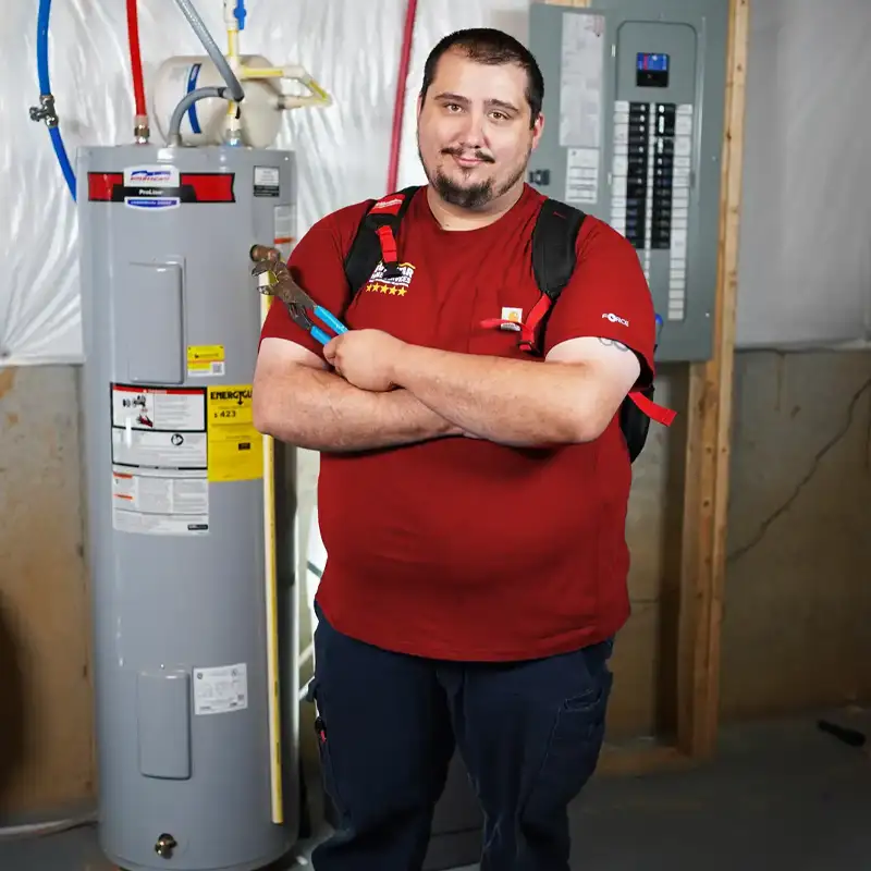 Plumbing with a flash light inspecting a sump pump