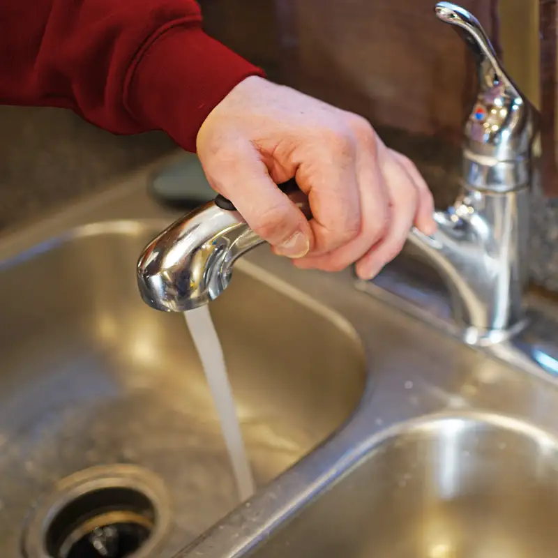 Running water from a faucet