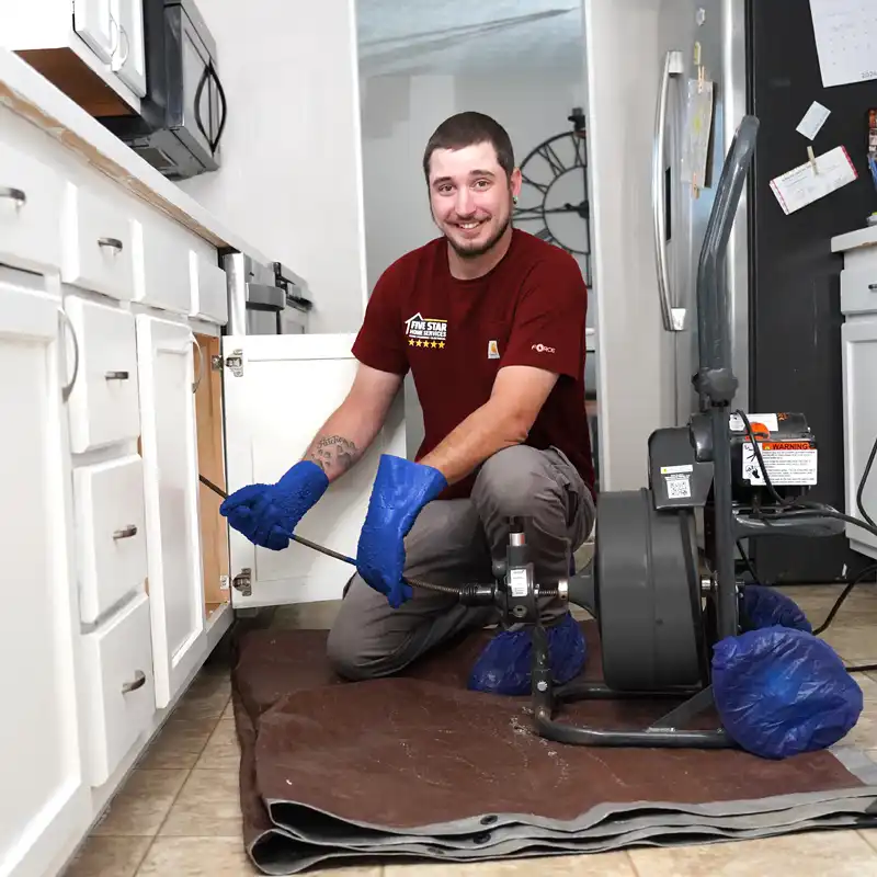 plumber fixing a sink