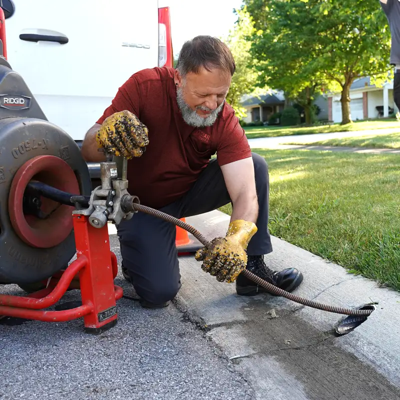 Plumber working on a sewer line